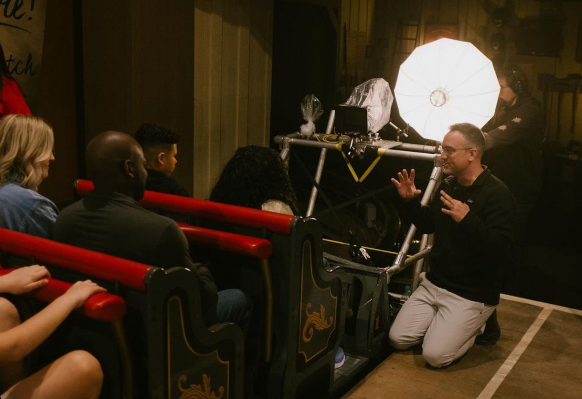 Directing talent on the ride vehicle between takes