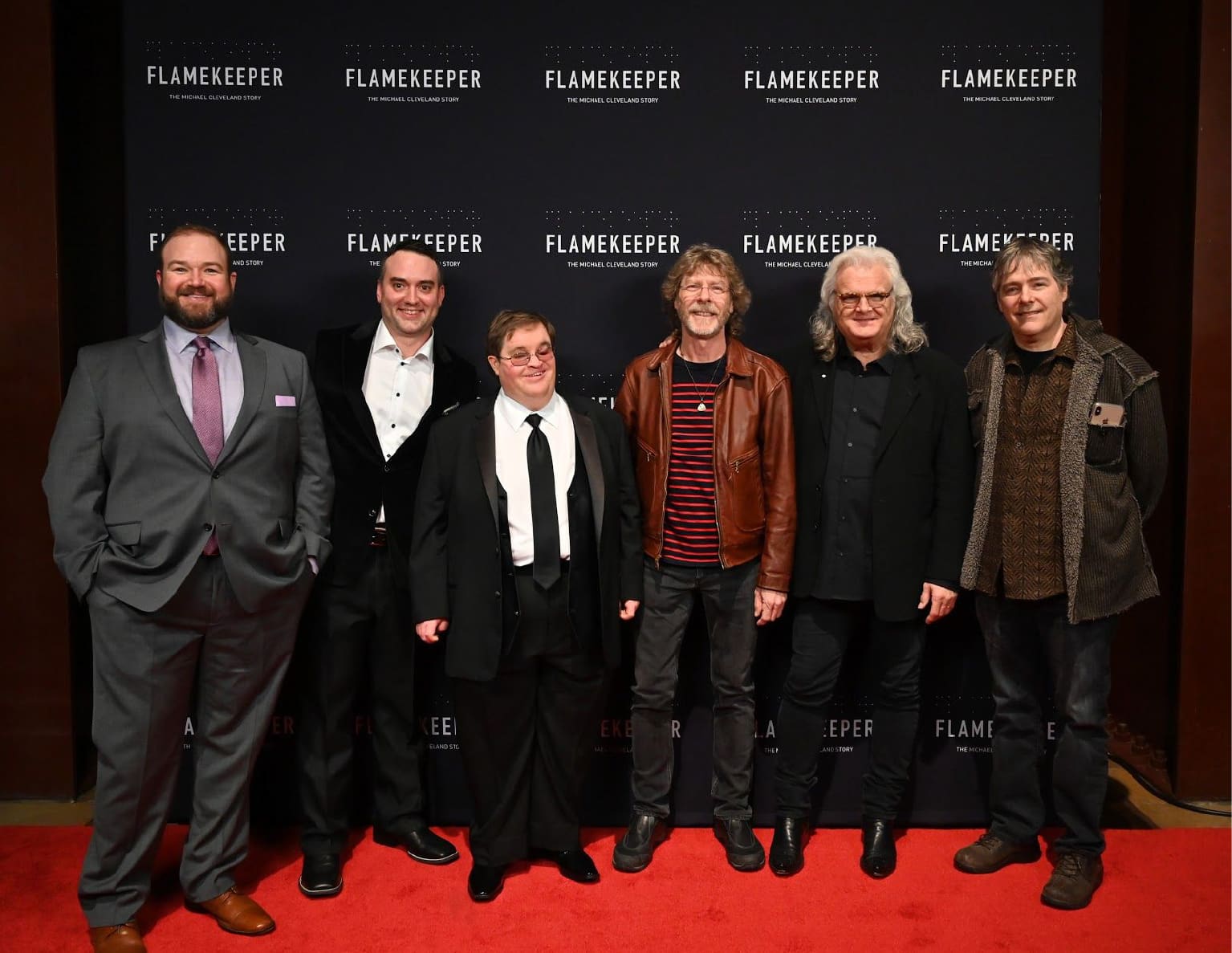 Cast and crew group photo on the red carpet