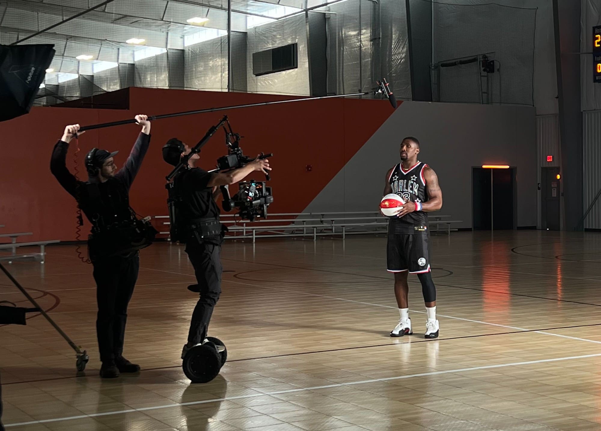 Boom operator and Steadicam operator on a Segway tracking a Harlem Globetrotter mid-shot