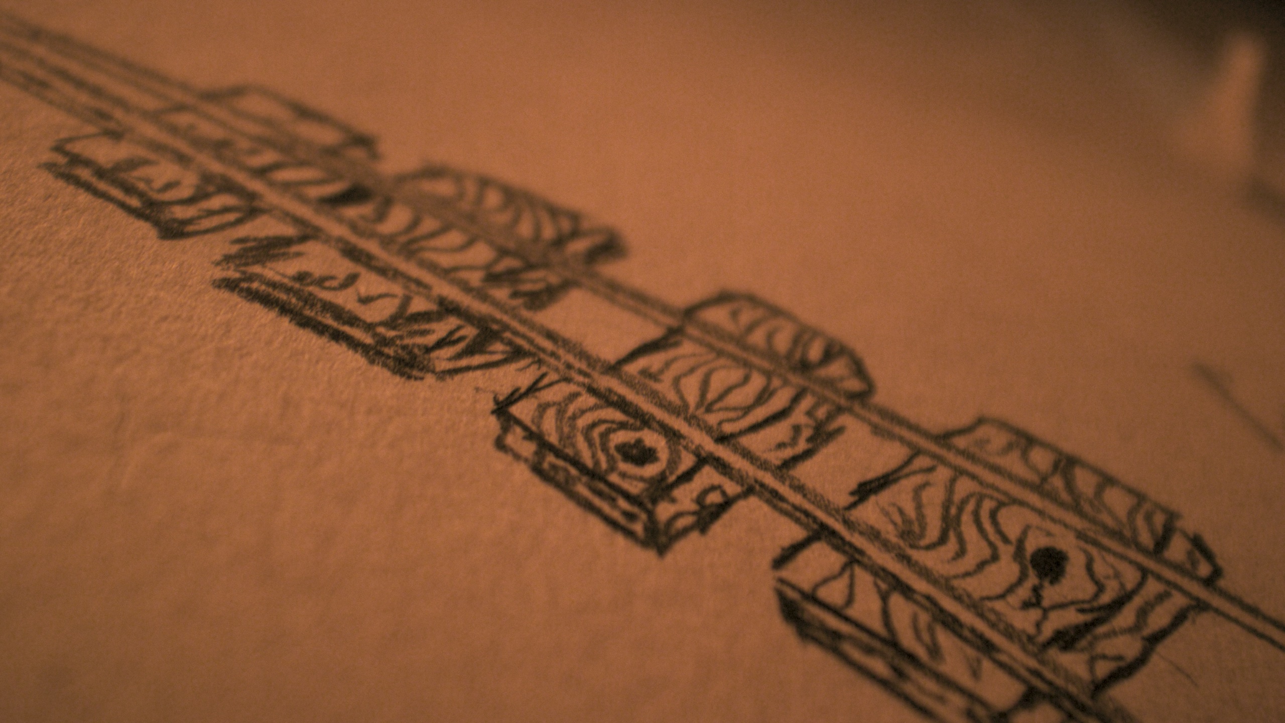 Hand-drawn concept sketch of connected mine train cars