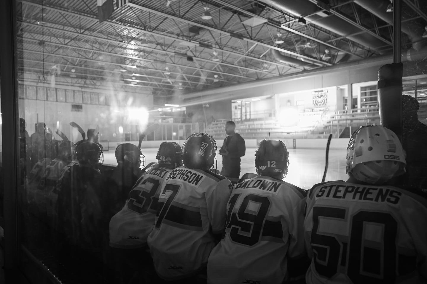 Missouri State Ice Bears players watching from the bench