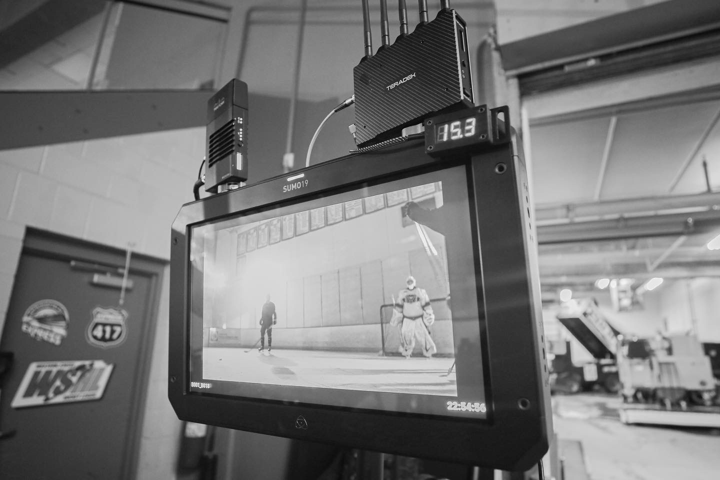 Production monitor framing a goalie on the ice