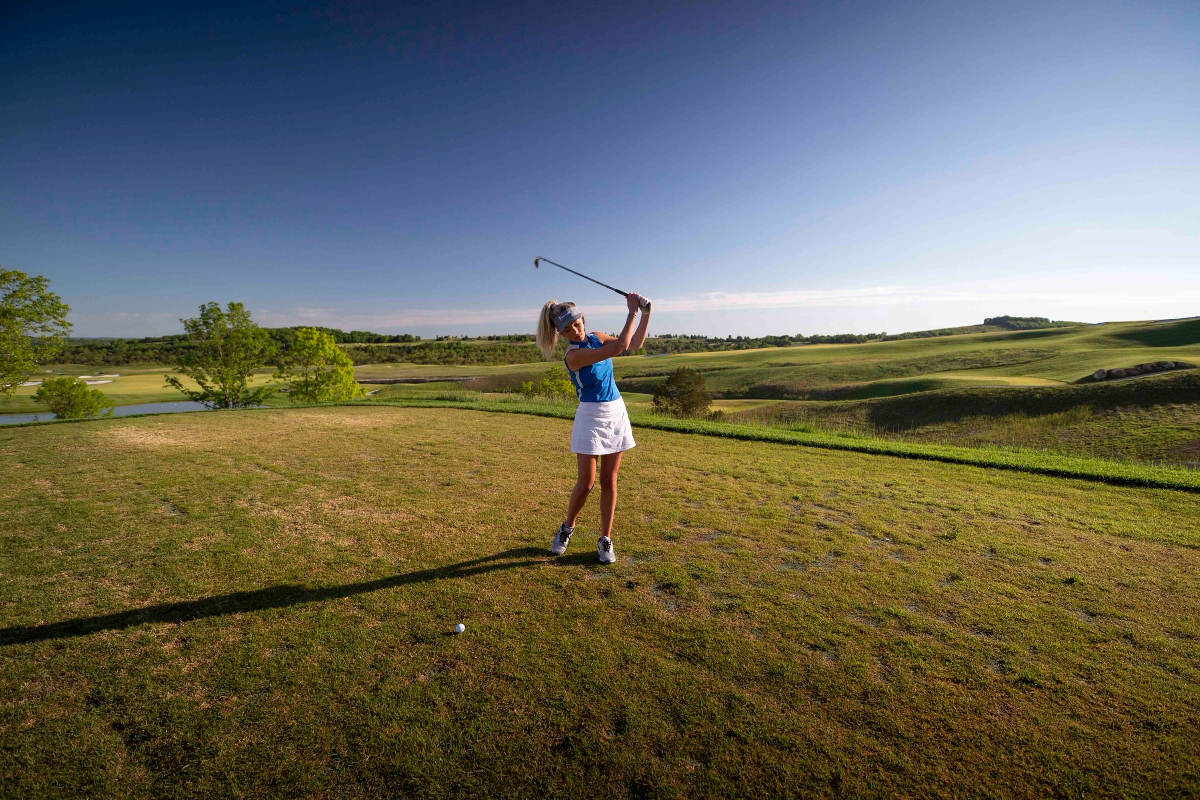 Golfer teeing off at Payne's Valley at Big Cedar Golf