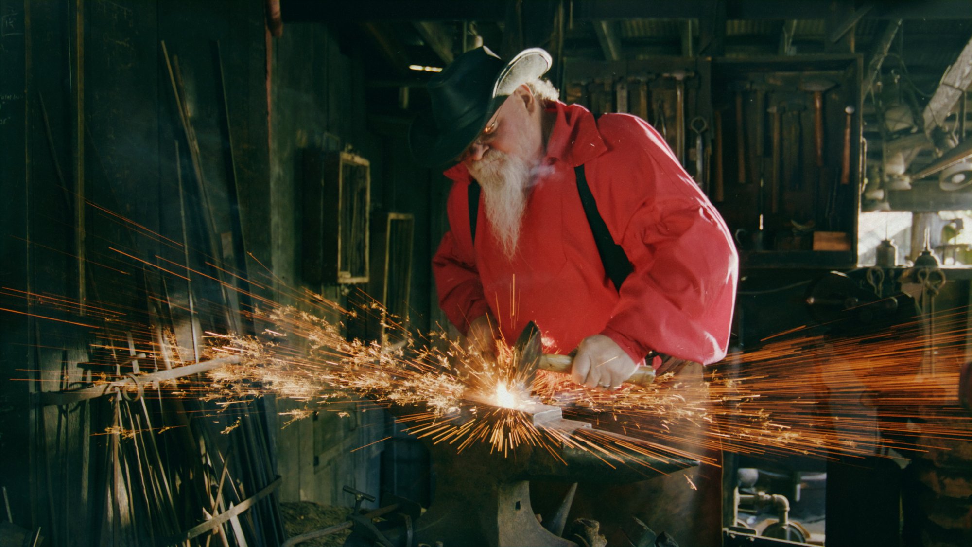 Blacksmith sparks flying during a heritage craft moment