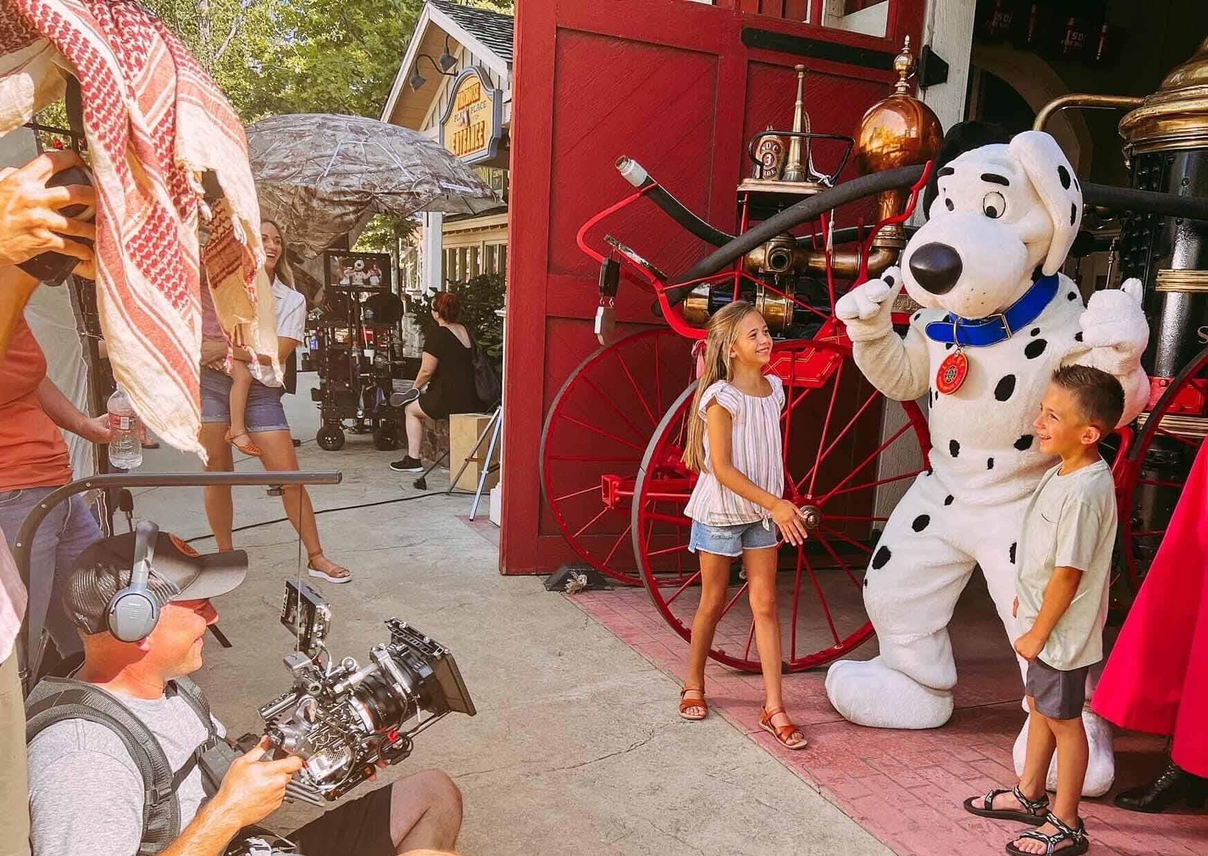 Kids meeting a dalmatian in the park square